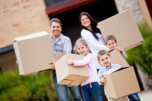A local moving team preparing packed items for transport in Sidcup