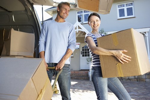 Careful lifting of bulky items from a flat staircase