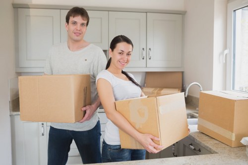 Family preparing for a move with labelled boxes and essentials